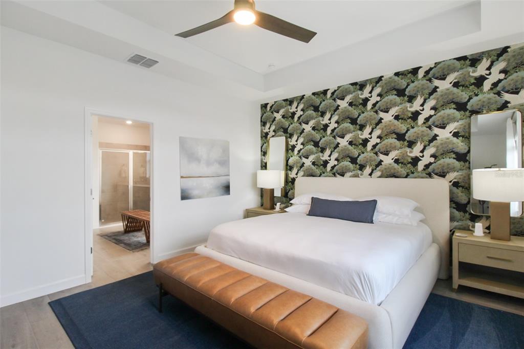 15025 Sea Salt Way Bradenton, FL 34211 - Photo 42 of 64 a bedroom with a bed and wooden floor