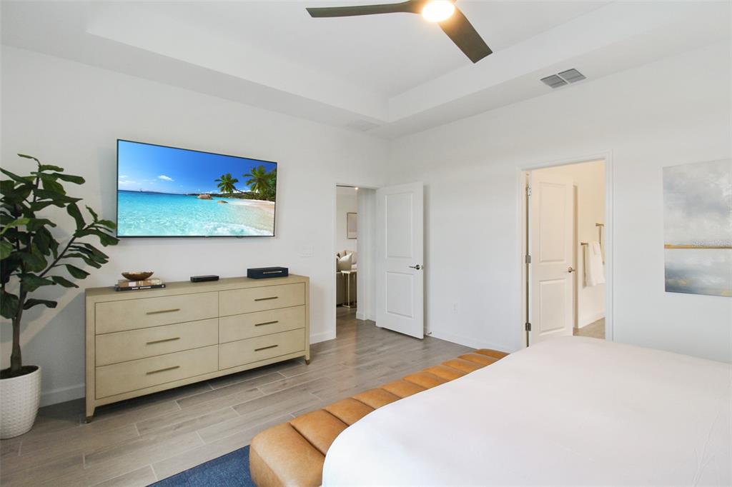 15025 Sea Salt Way Bradenton, FL 34211 - Photo 43 of 64 a bedroom with a bed and a dresser