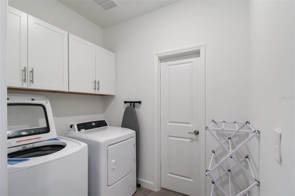 15025 Sea Salt Way Bradenton, FL 34211 - Photo 52 of 64 a view of storage and utility room with washer and dryer