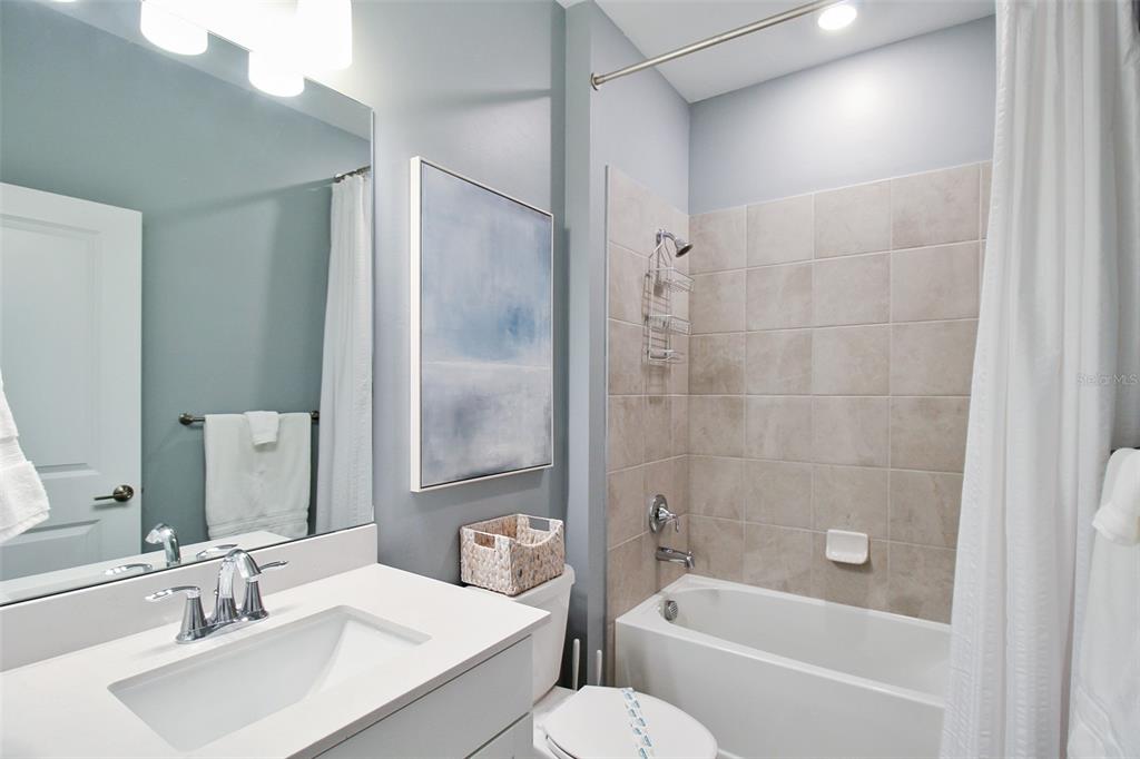 15025 Sea Salt Way Bradenton, FL 34211 - Photo 54 of 64 a bathroom with a bathtub shower sink vanity and toilet