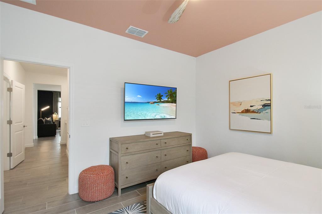 15025 Sea Salt Way Bradenton, FL 34211 - Photo 56 of 64 a bedroom with two bed and a painting on the wall