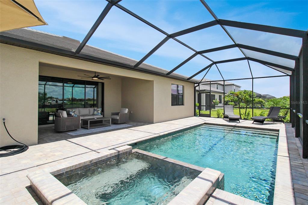 15025 Sea Salt Way Bradenton, FL 34211 - Photo 59 of 64 a view of a backyard with a tub and wooden fence