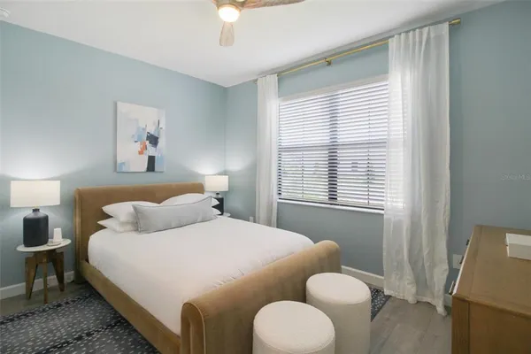 a bedroom with a bed and a couch