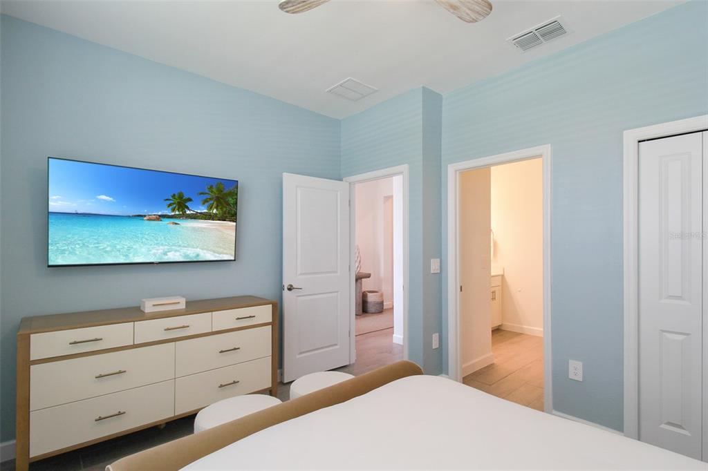15025 Sea Salt Way Bradenton, FL 34211 - Photo 9 of 64 a bedroom with a bed and a dresser in it