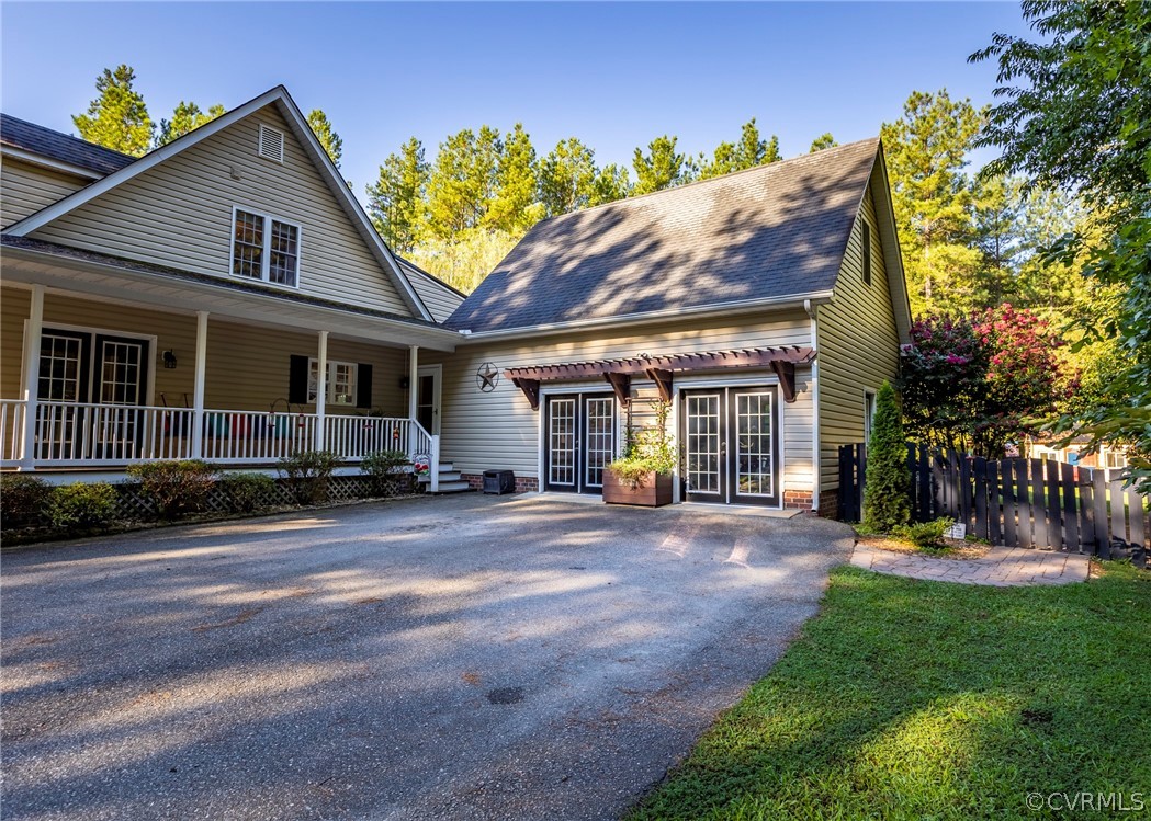 5776 Moore Creek Road Powhatan, VA 23139 - Photo 3 of 45 a view of a house with a patio