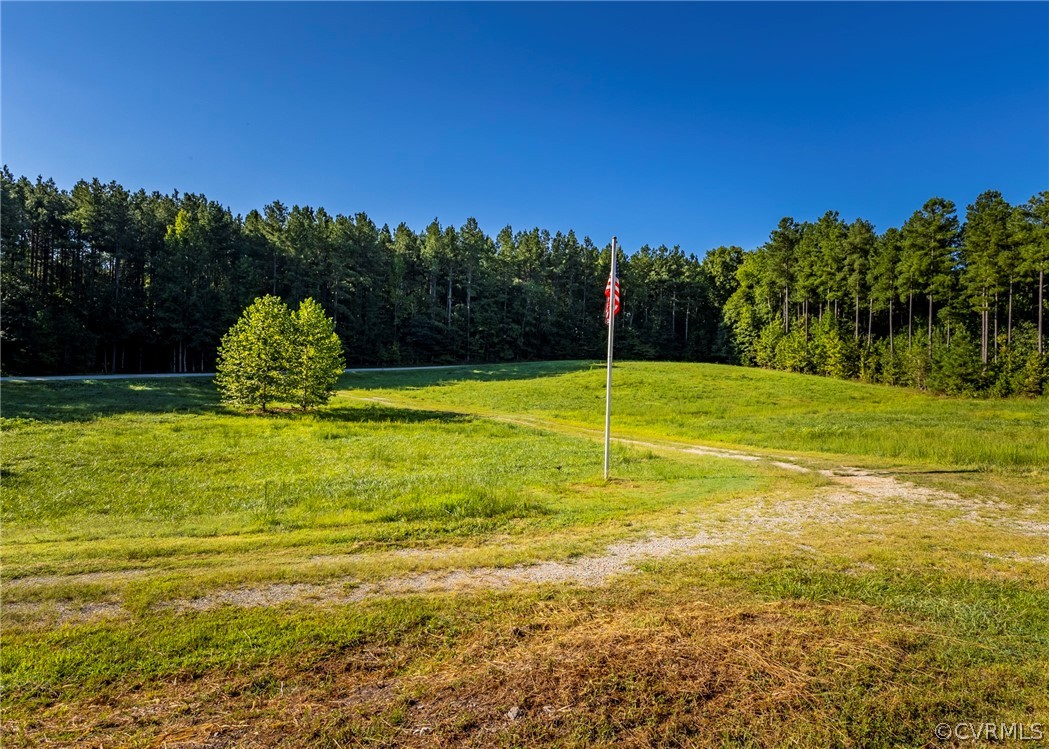 5776 Moore Creek Road Powhatan, VA 23139 - Photo 7 of 45 a view of a swimming pool with an outdoor space and seating area
