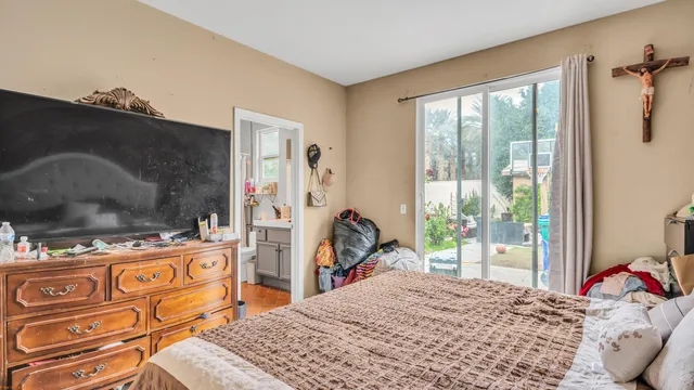 a room that has a bed and a table in it