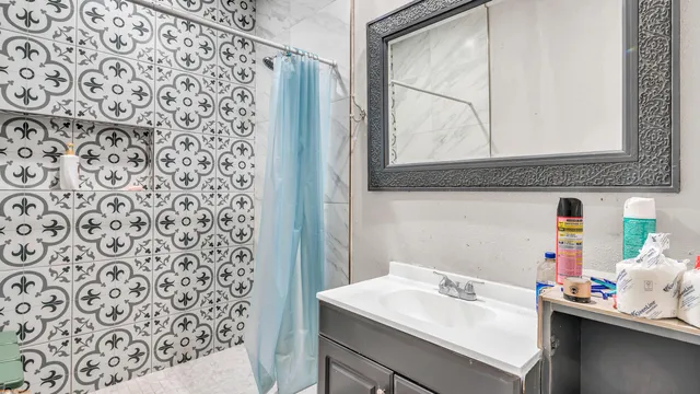 a bathroom with a sink and a mirror
