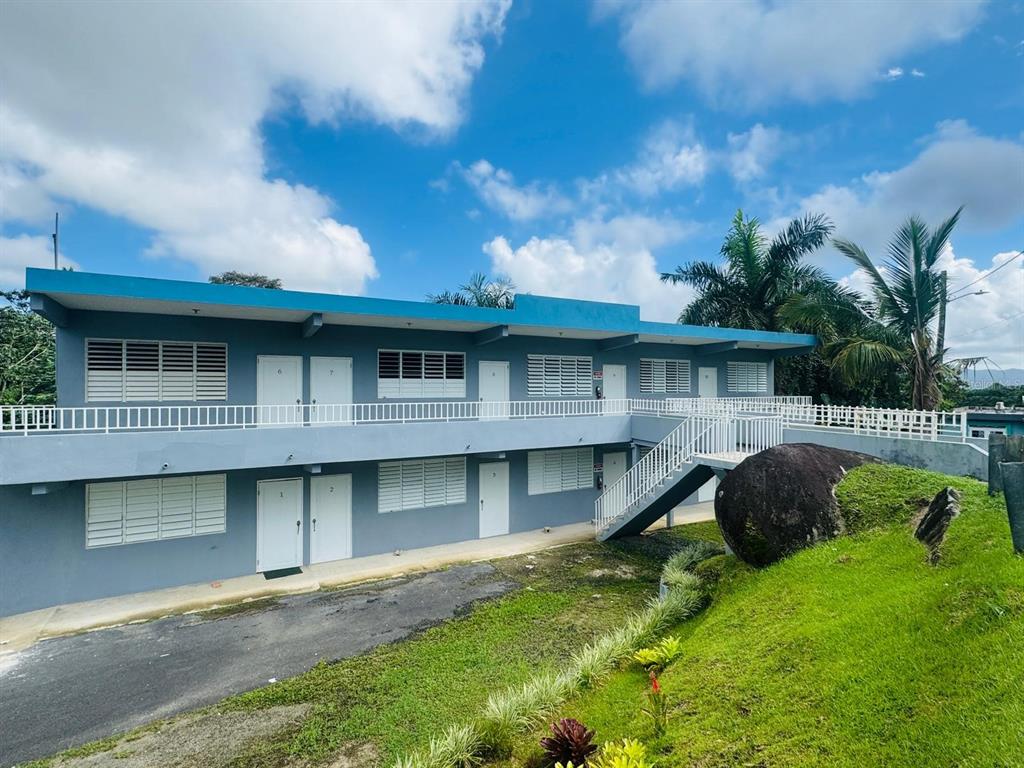 908 Bo Tejas, Unit 7 Humacao, PR 00791 - Photo 2 of 7 a front view of a house with a garden