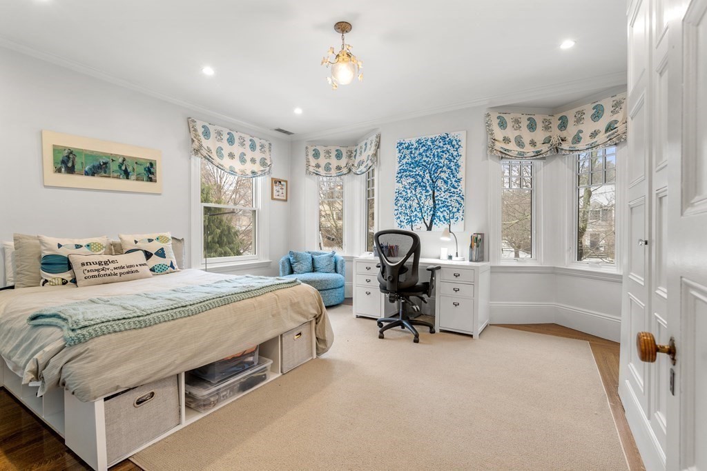 351 Otis Street Newton, MA 02465 - Photo 13 of 30 a bedroom with a bed couch and a window