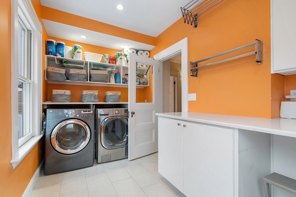 351 Otis Street Newton, MA 02465 - Photo 17 of 30 a utility room with dryer and washer