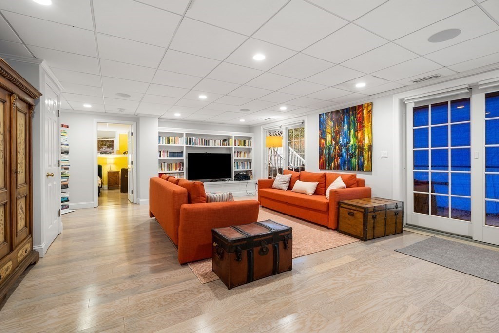 351 Otis Street Newton, MA 02465 - Photo 25 of 30 a living room with furniture and a flat screen tv