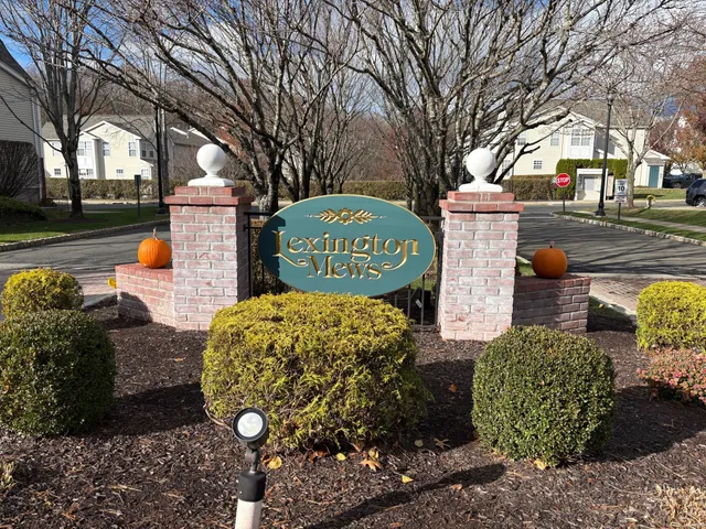 a view of a white house with a outdoor space
