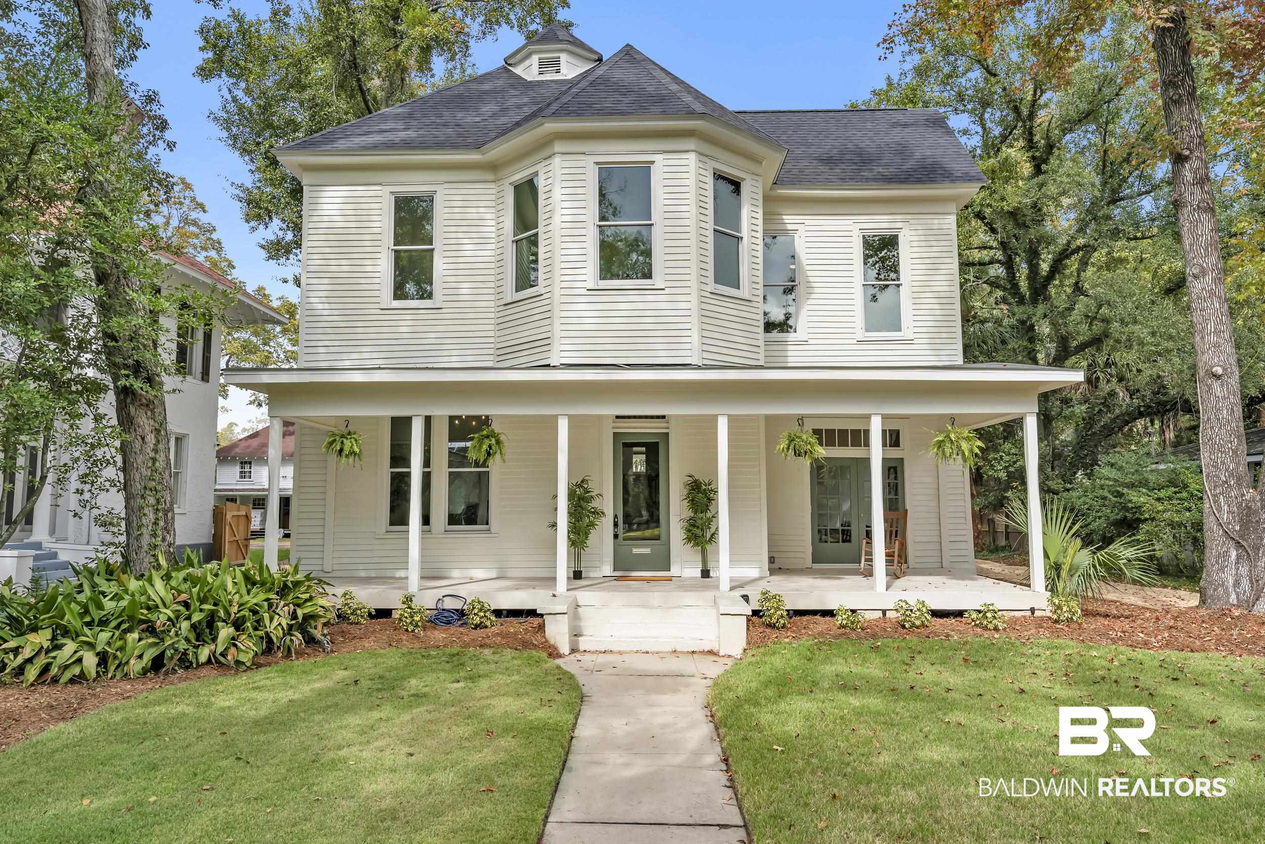 1662 Government Street Mobile, AL 36604 - Photo 1 of 33 Victorian house with roof with shingles, a porch, and a front yard