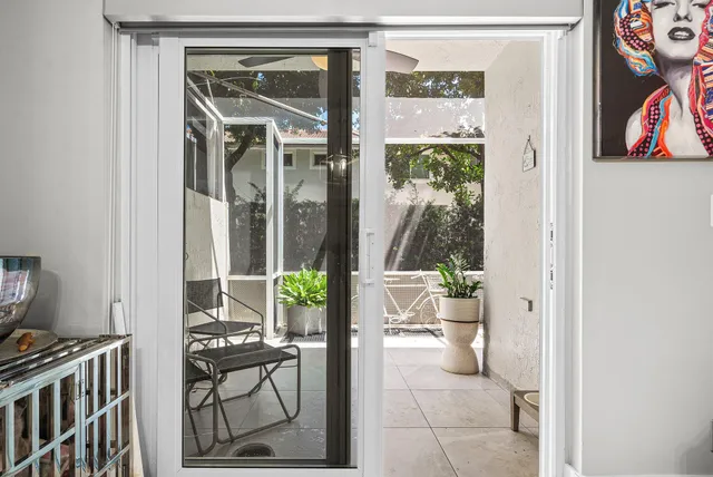 a view of a hallway with living room and dining room view