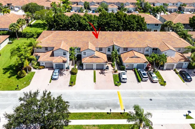 an aerial view of a house with a garden