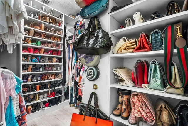 a bathroom with a double vanity sink mirror and shower