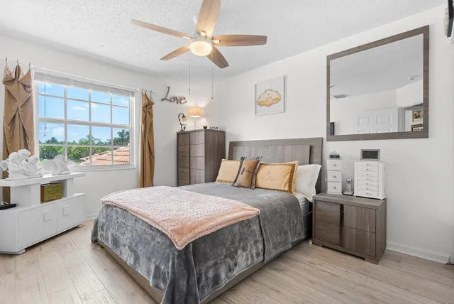 a view of a glass door with a tree in the background