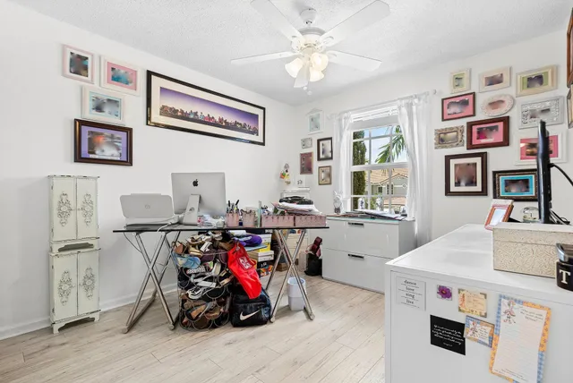 a bathroom with a granite countertop sink a toilet and a bathtub