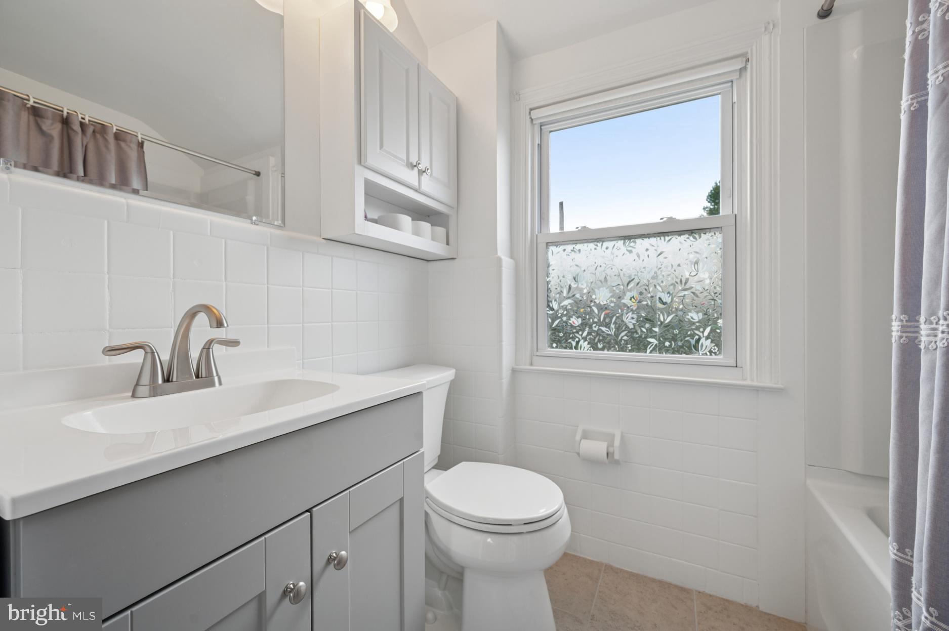 104 Scheivert Avenue Aston, PA 19014 - Photo 15 of 20 a bathroom with a toilet sink and mirror