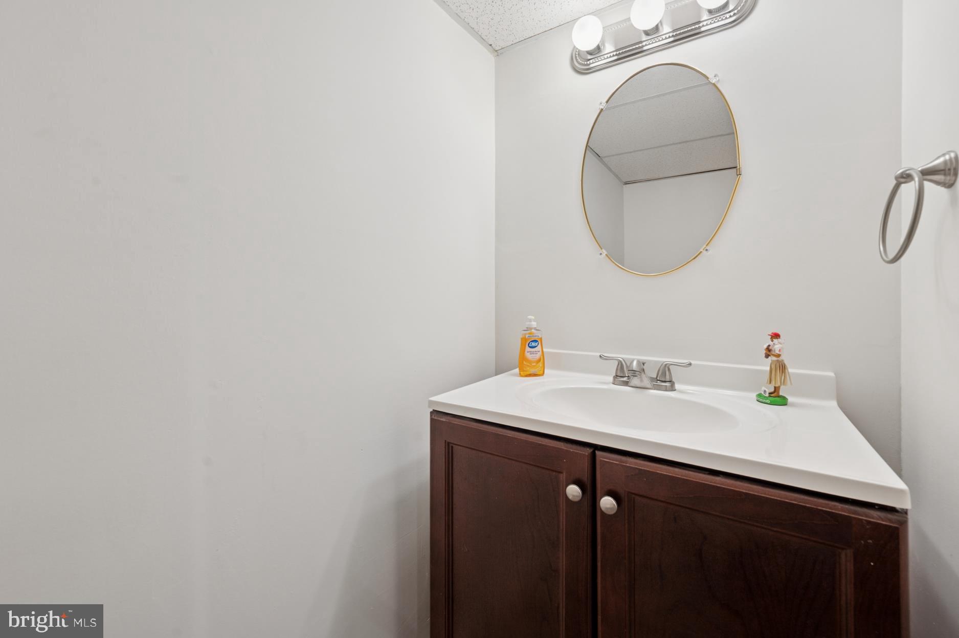 104 Scheivert Avenue Aston, PA 19014 - Photo 16 of 20 a bathroom with a sink and a mirror