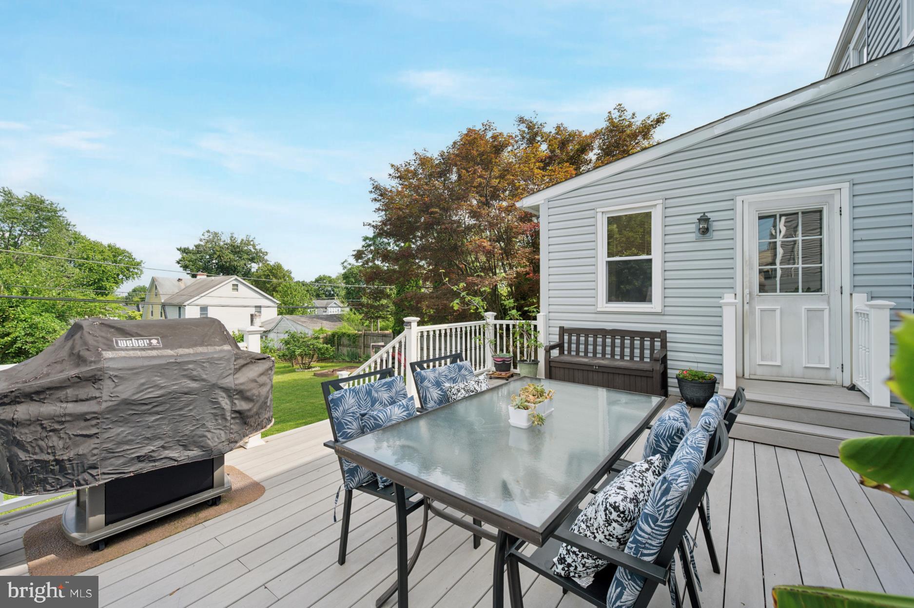 104 Scheivert Avenue Aston, PA 19014 - Photo 18 of 20 a balcony of a house with wooden floor outdoor seating and yard in the back