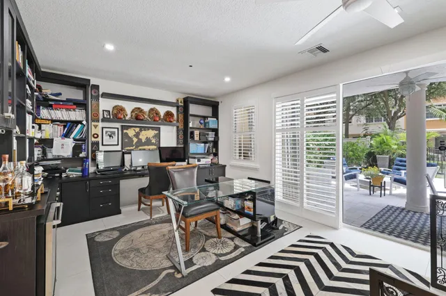 a view of a dining room that has a table and chairs