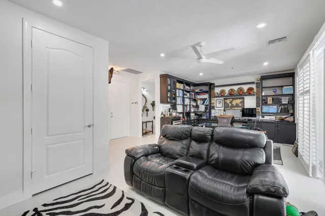 a view of a chairs and table in the back yard