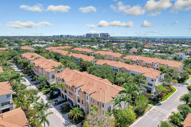 an aerial view of residential houses with outdoor space