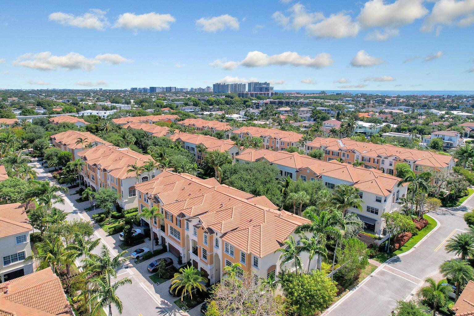 5530 Northeast Trieste Terrace, Unit 5530 Boca Raton, FL 33487 - Photo 2 of 57 an aerial view of residential houses with outdoor space