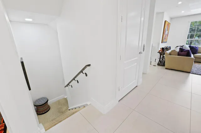 a kitchen with lots of counter top space sink and stainless steel appliances