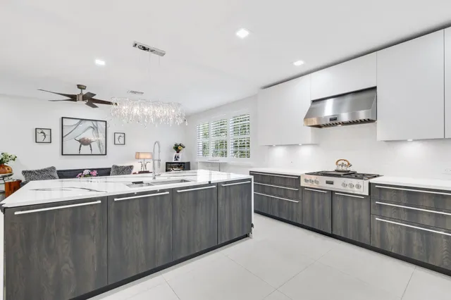 a kitchen that has a table and chairs in it