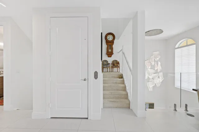 a view of a hallway with paintings on the wall