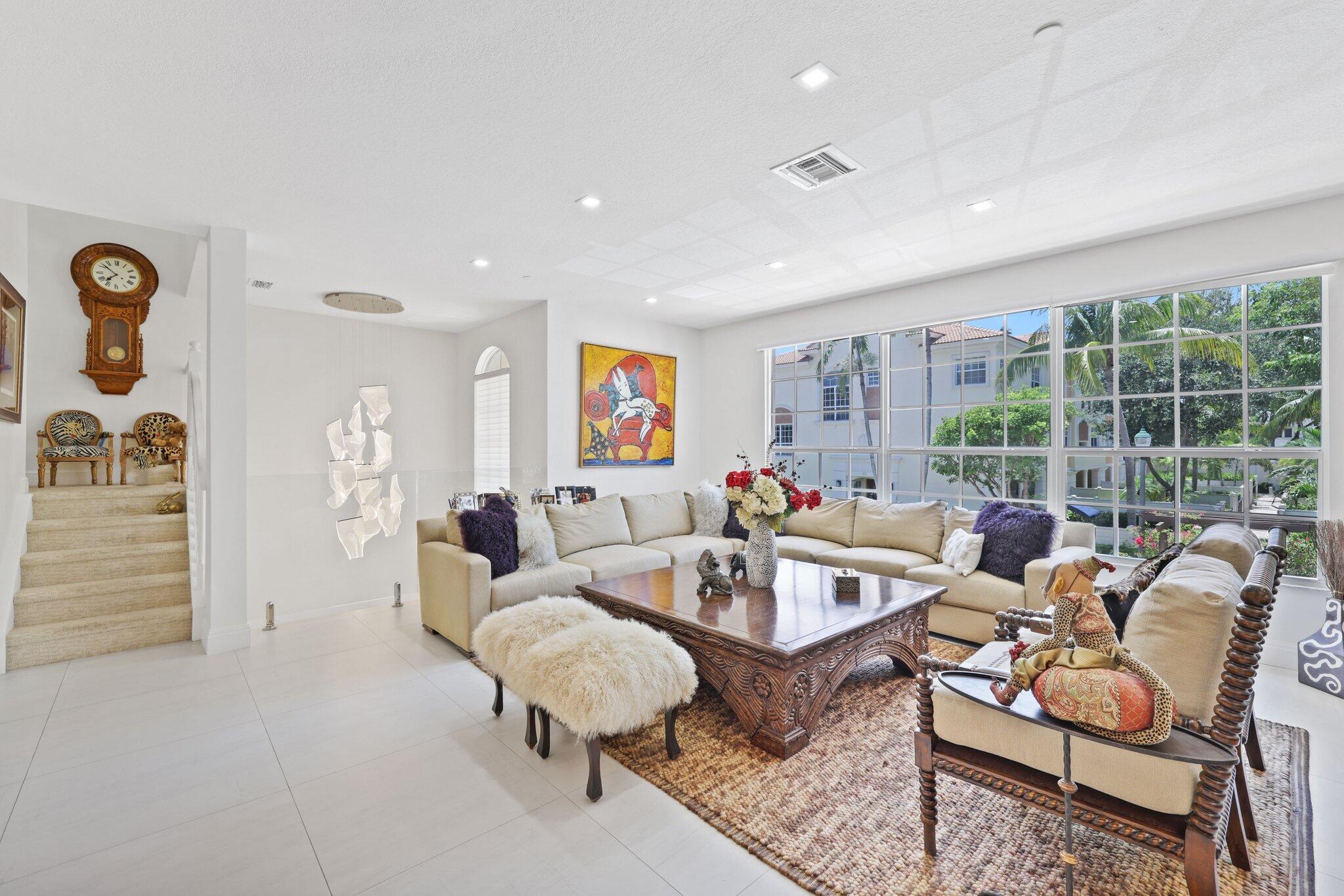 5530 Northeast Trieste Terrace, Unit 5530 Boca Raton, FL 33487 - Photo 37 of 57 a living room with furniture and a large window