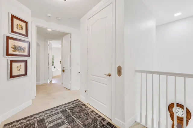 a spacious bathroom with a double vanity sink mirror and bathtub