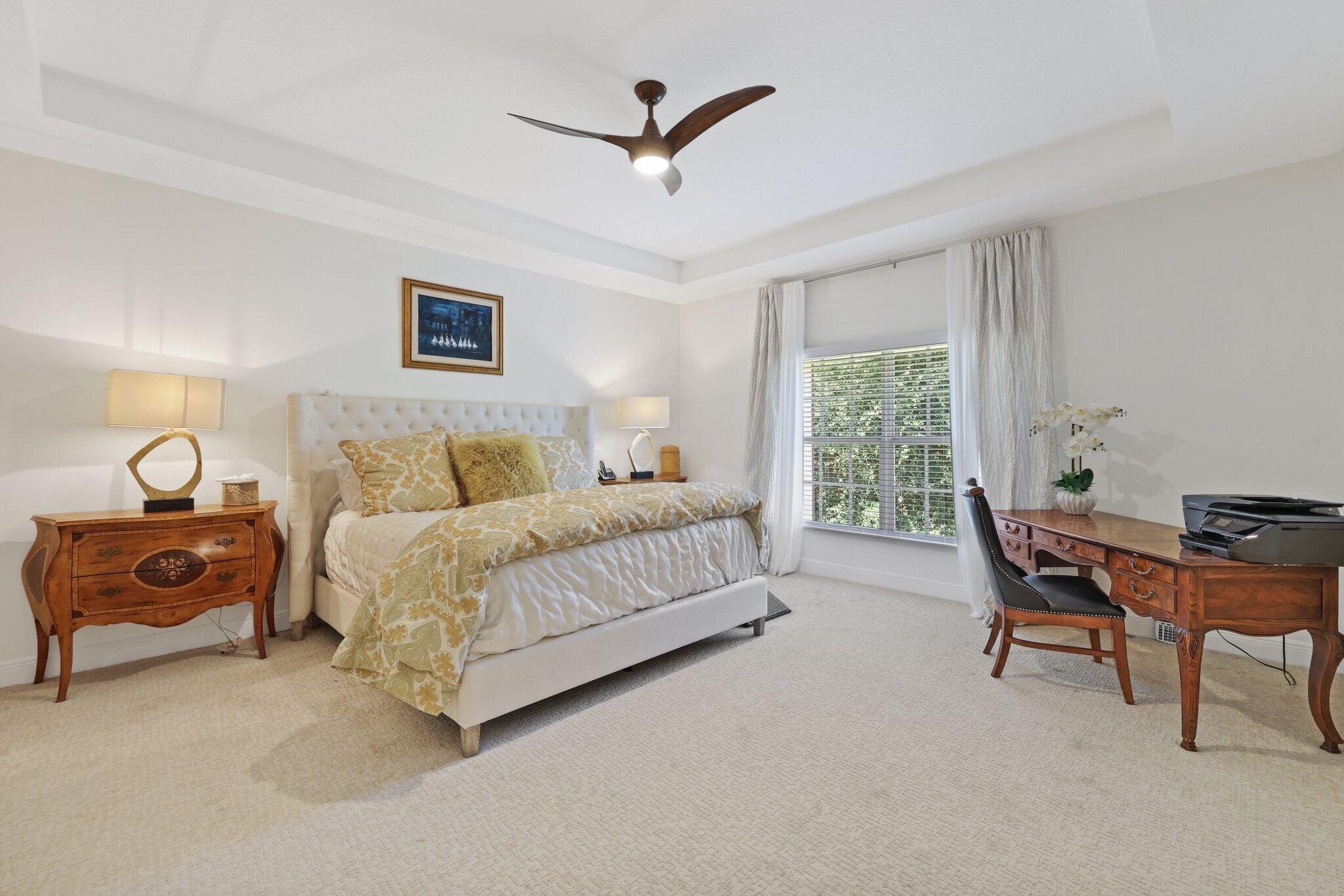 5530 Northeast Trieste Terrace, Unit 5530 Boca Raton, FL 33487 - Photo 42 of 57 a bed room with a bed and a chair