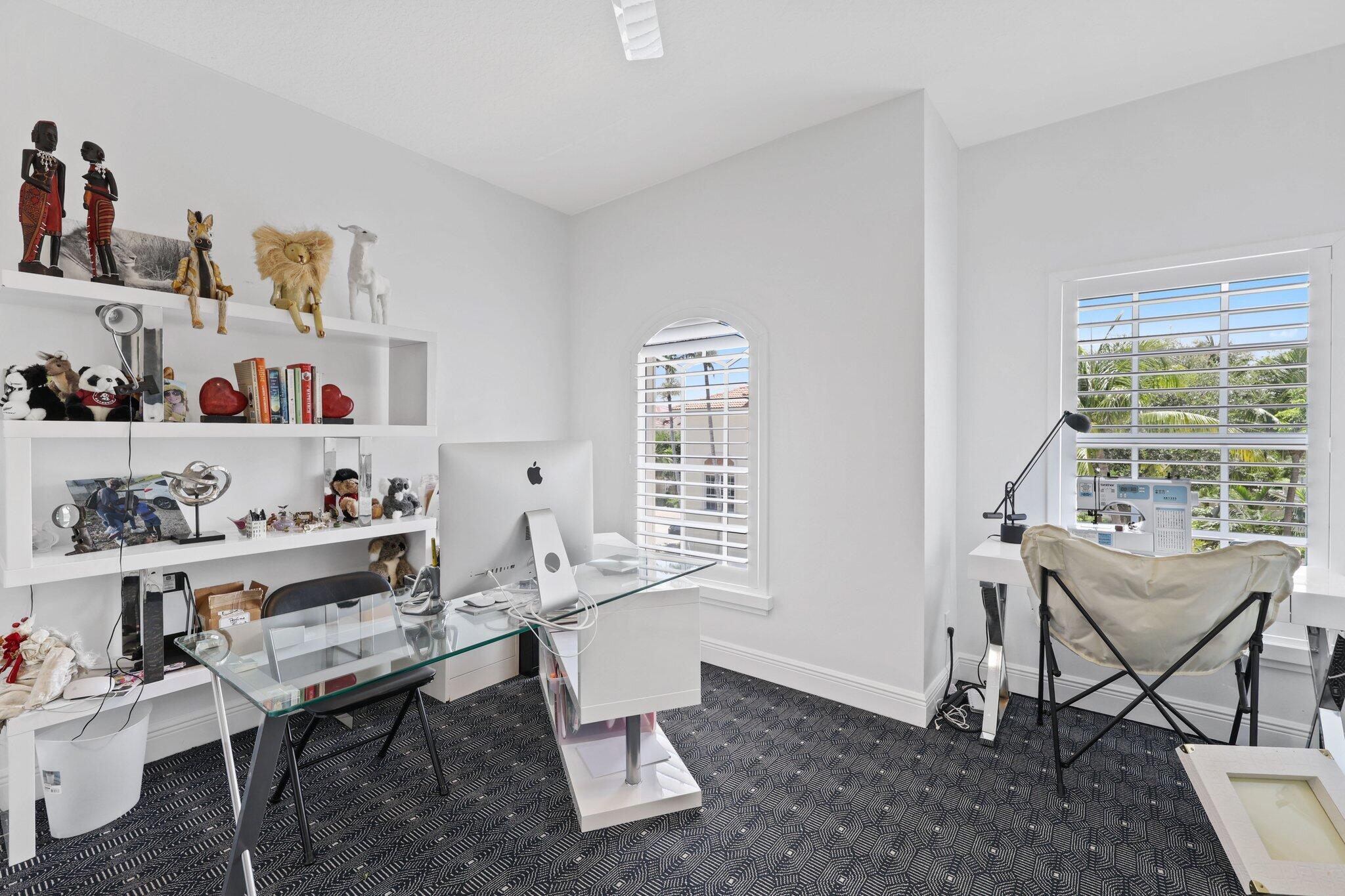 5530 Northeast Trieste Terrace, Unit 5530 Boca Raton, FL 33487 - Photo 54 of 57 a view of a workspace with furniture and a window