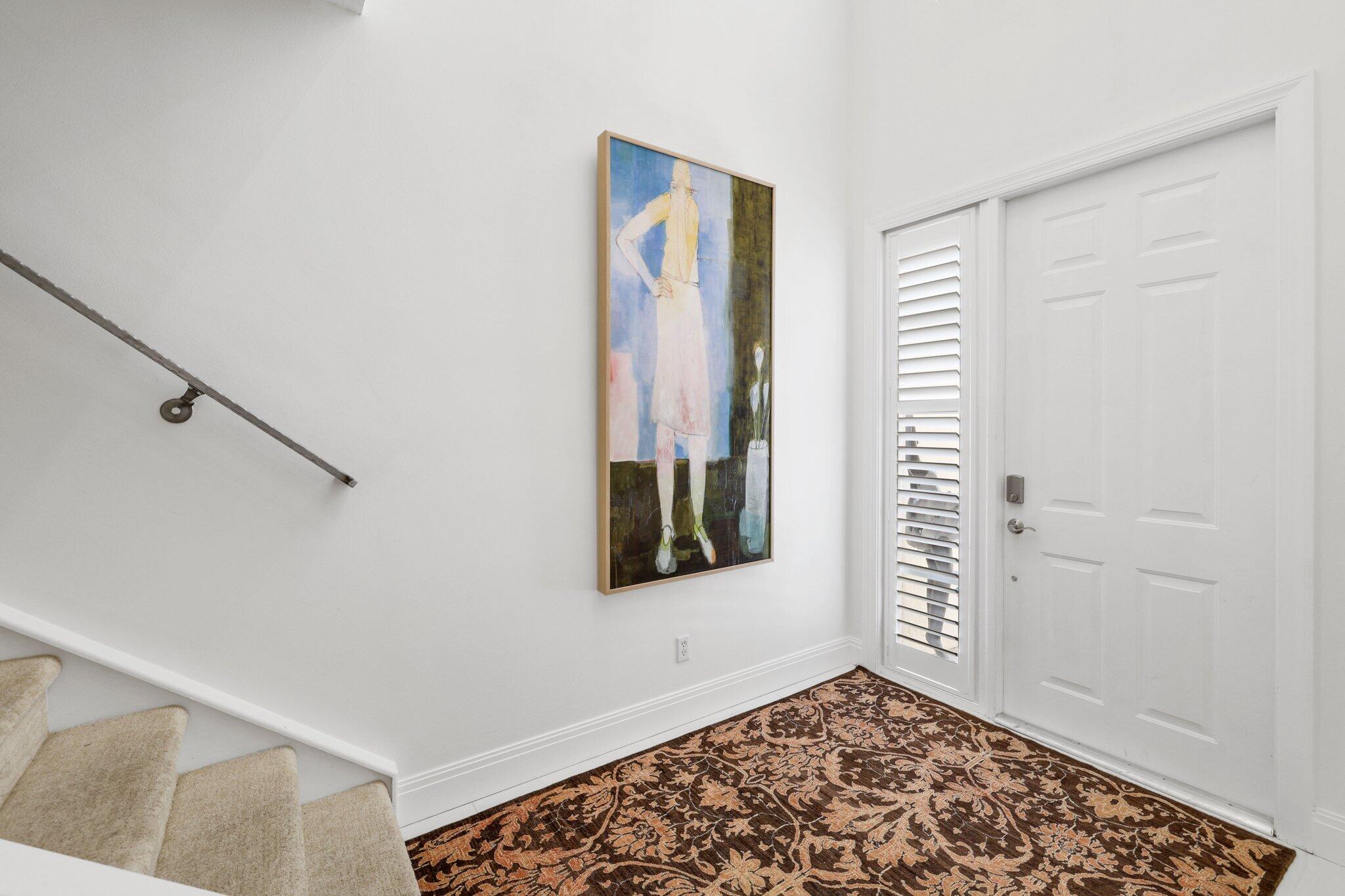 5530 Northeast Trieste Terrace, Unit 5530 Boca Raton, FL 33487 - Photo 6 of 57 a view of a hallway with front door