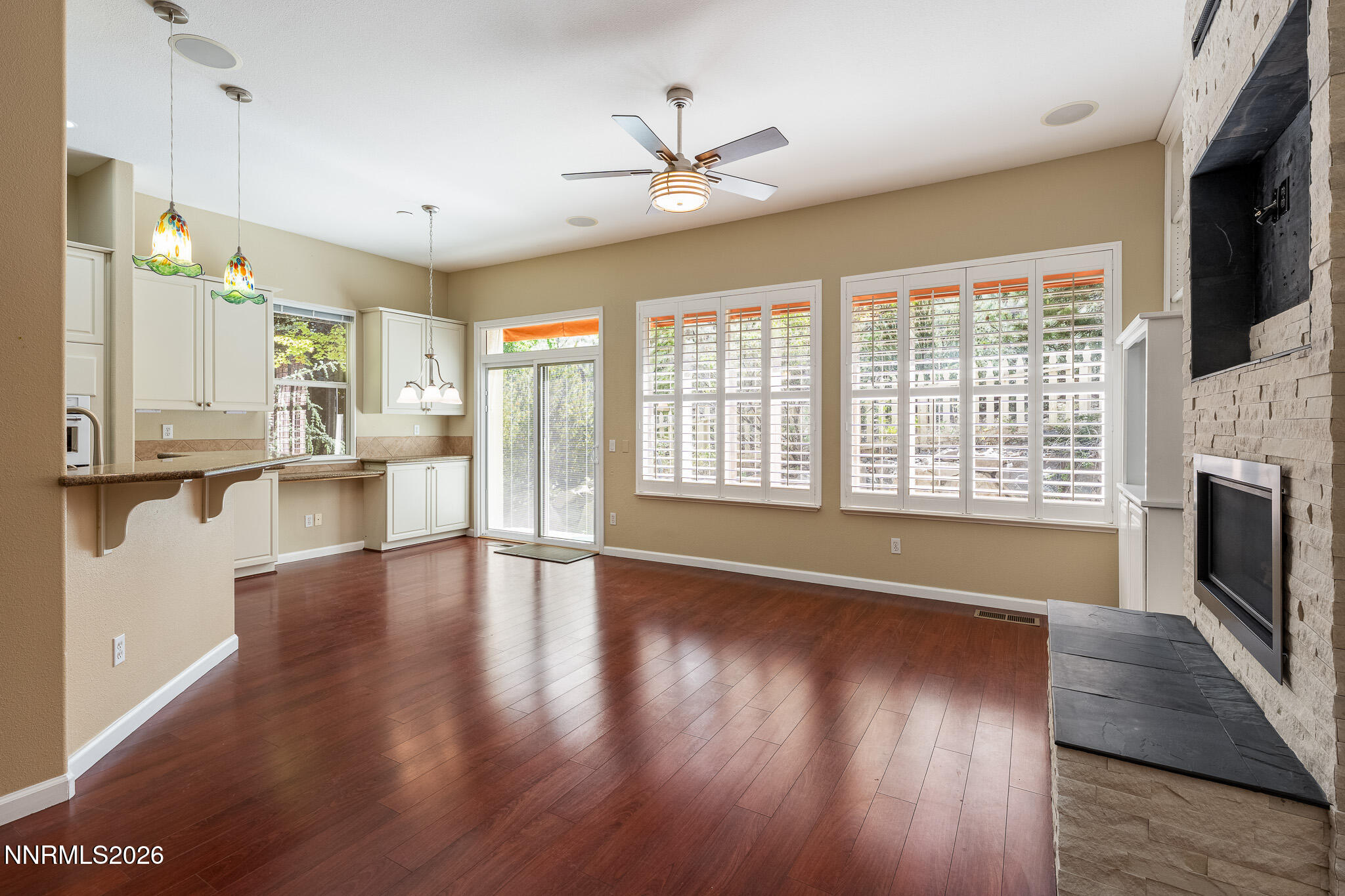 1840 Hunter Creek Road Reno, NV 89519 - Photo 2 of 39 a view of an empty room with wooden floor and a fireplace