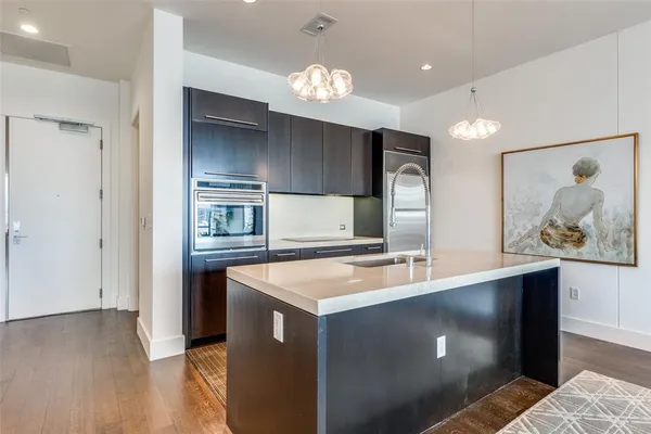 a view of kitchen with cabinets and wooden floor