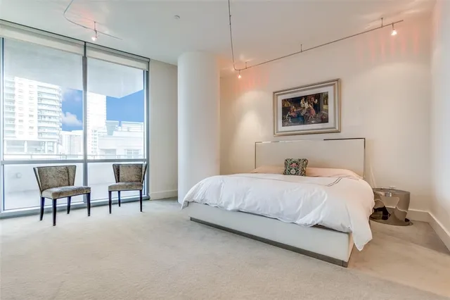 a kitchen with stainless steel appliances granite countertop a sink and a refrigerator