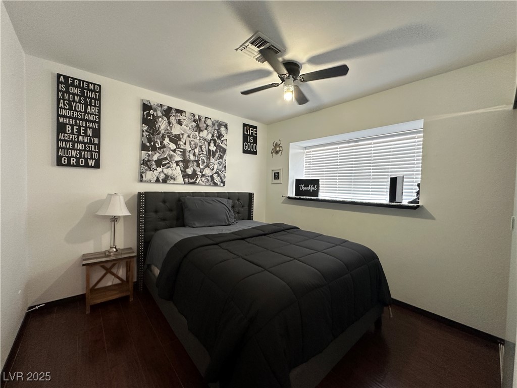 5929 West Cherokee Avenue Las Vegas, NV 89103 - Photo 15 of 30 Bedroom with dark wood-type flooring and a ceiling fan