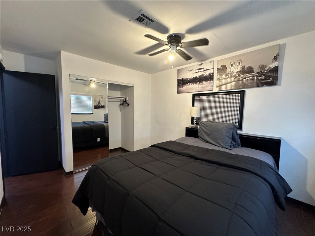 5929 West Cherokee Avenue Las Vegas, NV 89103 - Photo 21 of 30 Bedroom featuring dark wood-style flooring, a closet, and ceiling fan