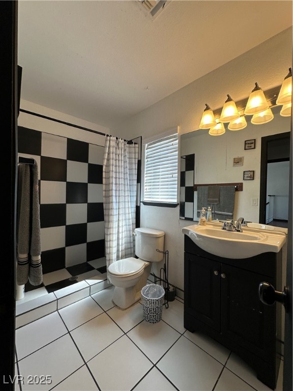 5929 West Cherokee Avenue Las Vegas, NV 89103 - Photo 24 of 30 Full bath with vanity, light tile patterned flooring, and a shower stall