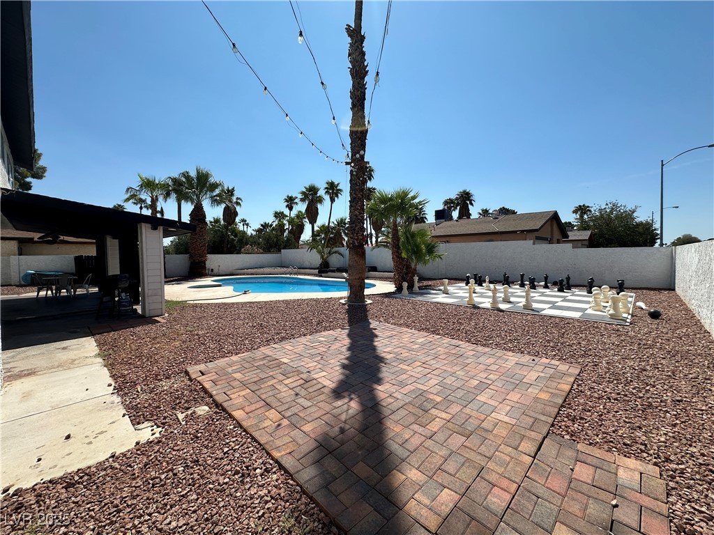 5929 West Cherokee Avenue Las Vegas, NV 89103 - Photo 28 of 30 View of pool with a patio area, a fenced backyard, and a ceiling fan