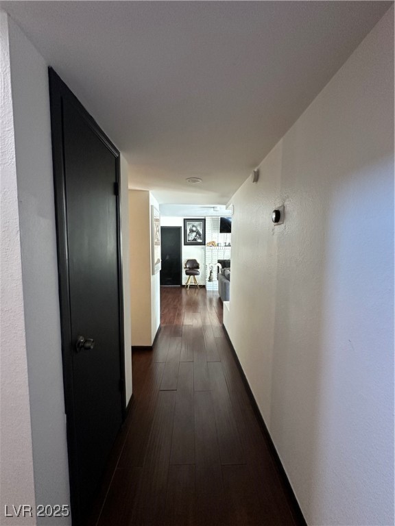 5929 West Cherokee Avenue Las Vegas, NV 89103 - Photo 4 of 30 Hall featuring dark wood finished floors and a textured wall