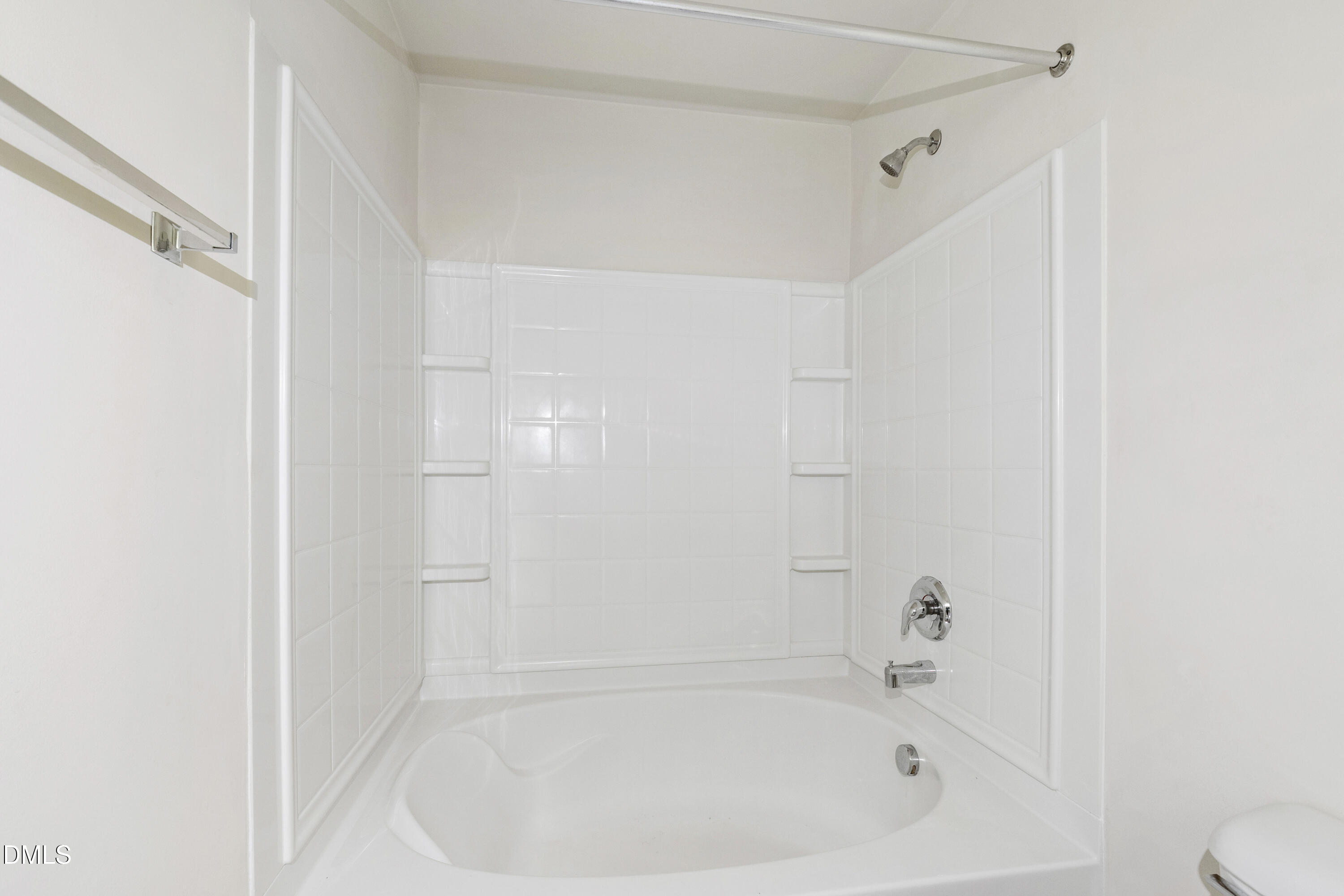 6617 Clarksburg Place Raleigh, NC 27616 - Photo 28 of 30 a close up of a bathtub in a bathroom