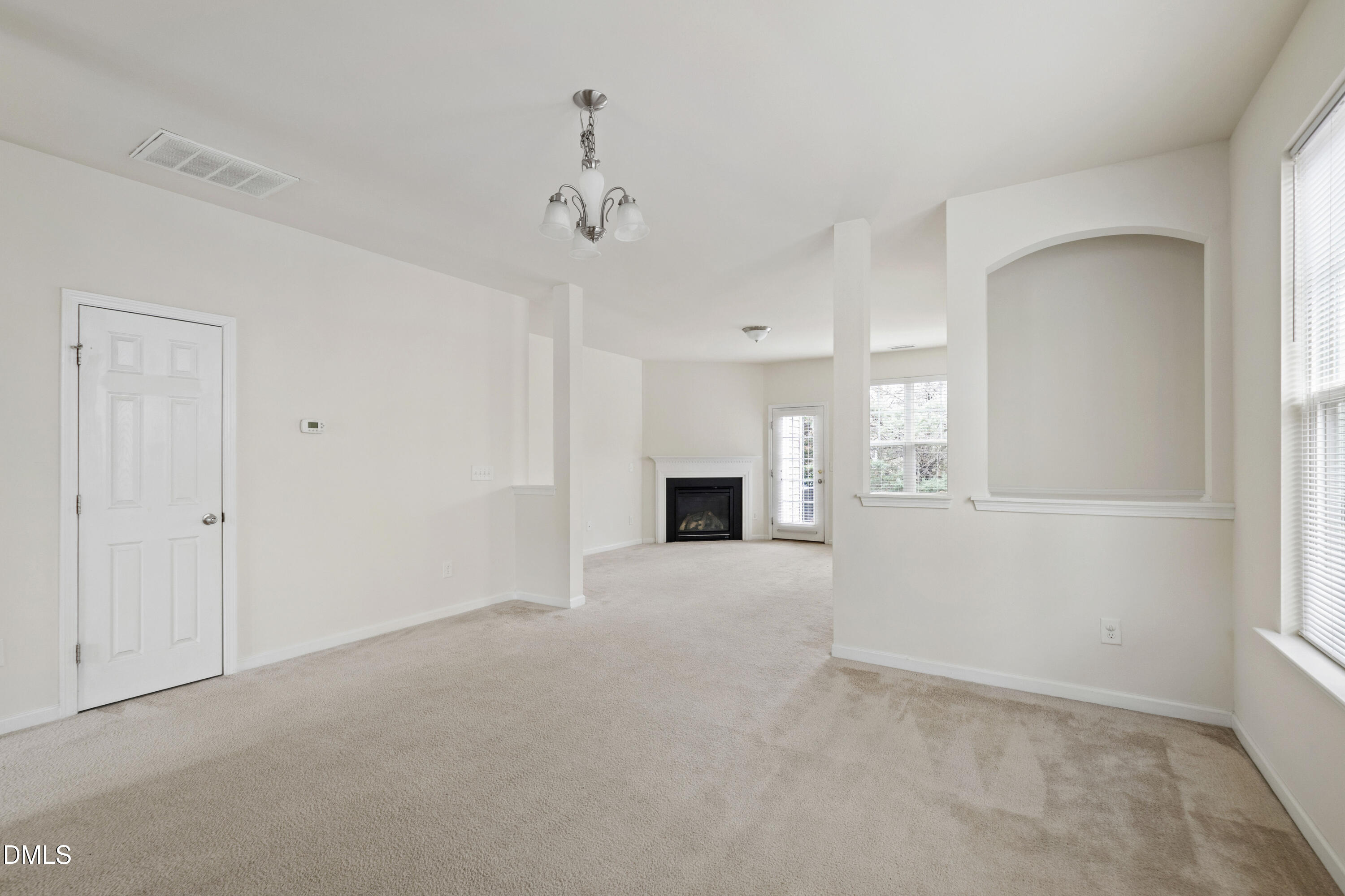 6617 Clarksburg Place Raleigh, NC 27616 - Photo 3 of 30 a view of an empty room with a window