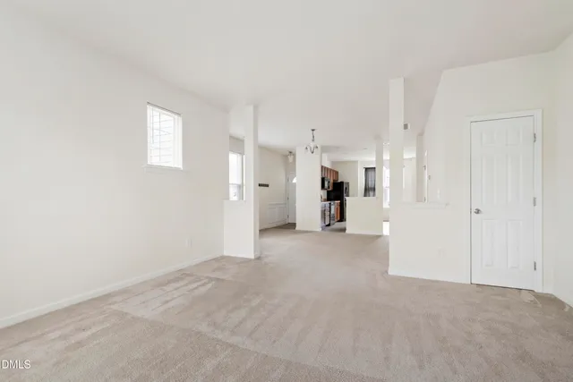 a view of empty room with floor to ceiling window