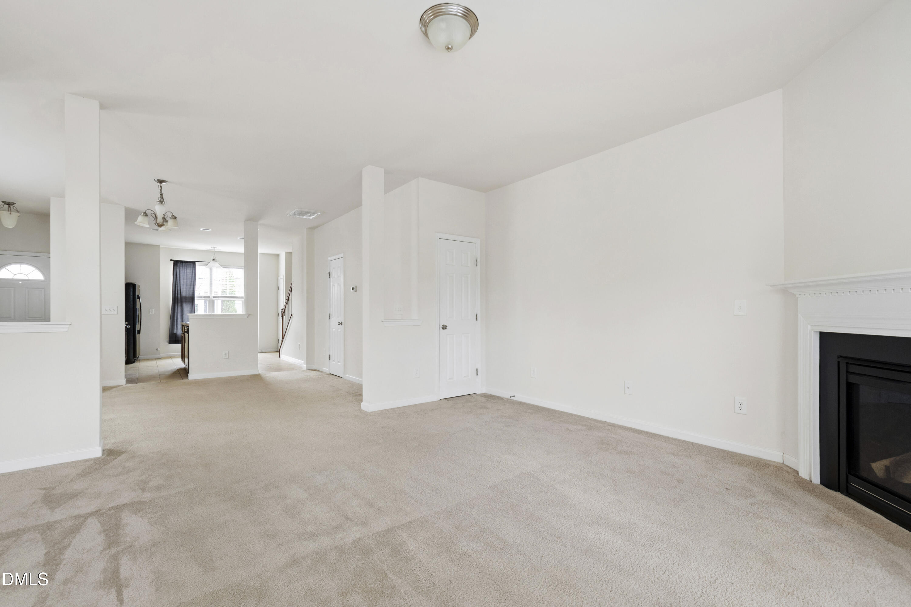 6617 Clarksburg Place Raleigh, NC 27616 - Photo 8 of 30 a view of empty room with floor to ceiling window